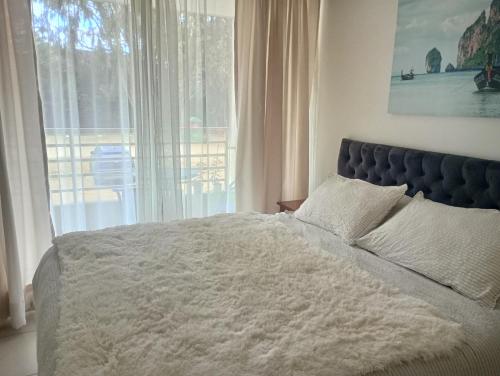Postel nebo postele na pokoji v ubytování Costa Algarrobo Norte