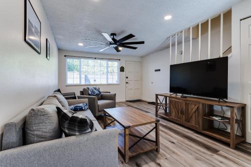 a living room with a couch and a flat screen tv at Getaway near UO, Autzen Stadium, Amazon Park # 3 in Eugene