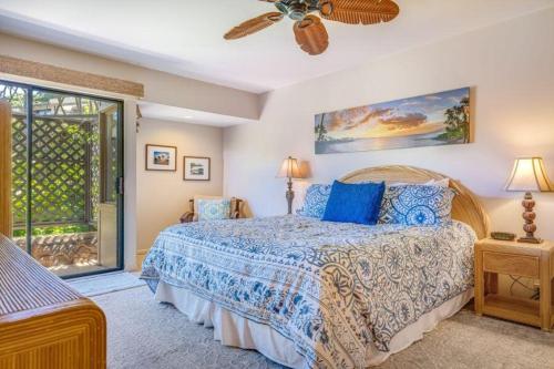 a bedroom with a bed and a ceiling fan at WAILEA ELUA, #2201^ condo in Wailea