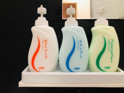 three bottles of toothbrushes sitting on a shelf at I・ecoⅢ（アイエコスリー） in Niigata