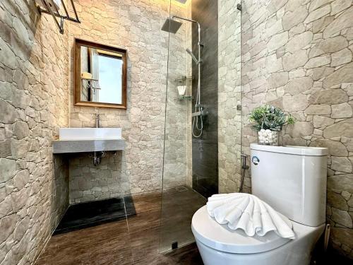 a bathroom with a toilet and a shower and a sink at The Blue Lion Villa koh Samui - Sea view in Chaweng Noi Beach