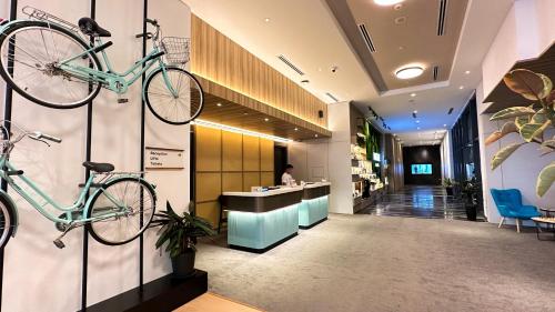 a lobby with two bikes hanging on the wall at INNSiDE by Meliá Kuala Lumpur in Kuala Lumpur