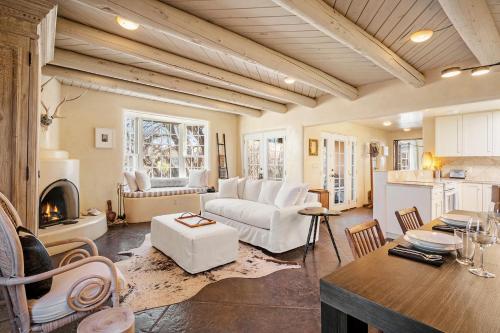 a living room with a couch and a table at Casa TATIZ • Privacy in a Southwestern Gem in Santa Fe