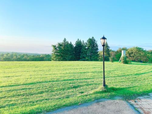 a light pole in the middle of a field at Large Estate 3 Bedroom Luxury Villa in King City