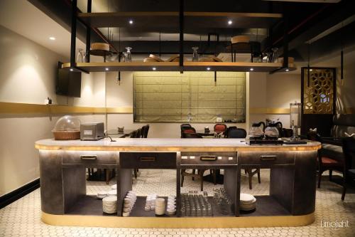 a kitchen with a large counter in a room at Belvedere Suites in Greater Noida