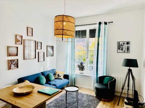 Ruang duduk di L'Herboriste - Appartements meublés