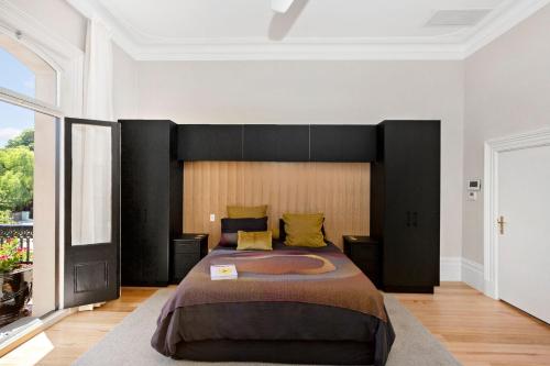מיטה או מיטות בחדר ב-Botanic Loft