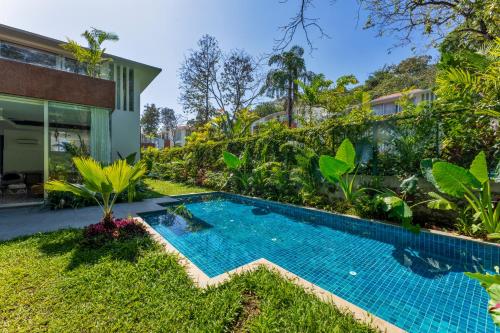 a swimming pool in the backyard of a house at La Macedo, Luxury 3 BHK Villas in Assagao, with Private Pool, Garden, Terrace, Parking, Security in Mapusa