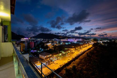 a view of a city at night at Patong Diamond Hotel in Patong Beach