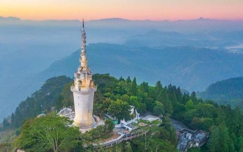 a tower on top of a hill with a view at The Grove in Kandy