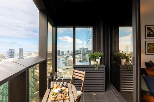 a balcony with a table and a view of the city at Fantastic Views at Luxury Prima Pearl Tower in Melbourne