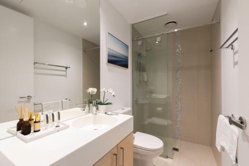 a bathroom with a sink and a toilet and a shower at Fantastic Views at Luxury Prima Pearl Tower in Melbourne