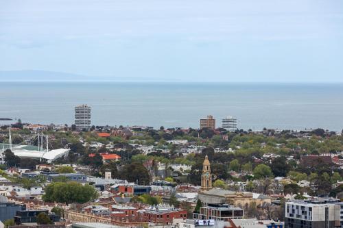 an aerial view of a city with the ocean in the background at Fantastic Views at Luxury Prima Pearl Tower in Melbourne