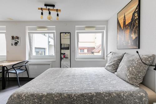 Ένα ή περισσότερα κρεβάτια σε δωμάτιο στο Résidence le premium, hyper centre, studio tout équipé