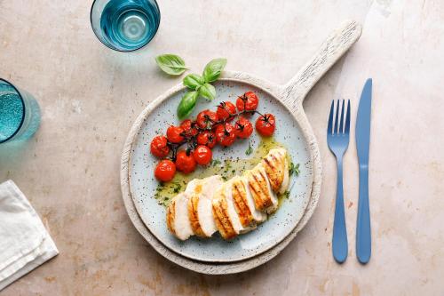 a plate of food with fish and tomatoes and a fork at ROBINSON JANDIA PLAYA - Adults only in Morro del Jable