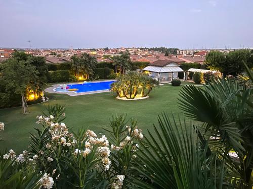 an aerial view of a yard with a swimming pool at Villa Angela Luxury Relax in Desenzano del Garda