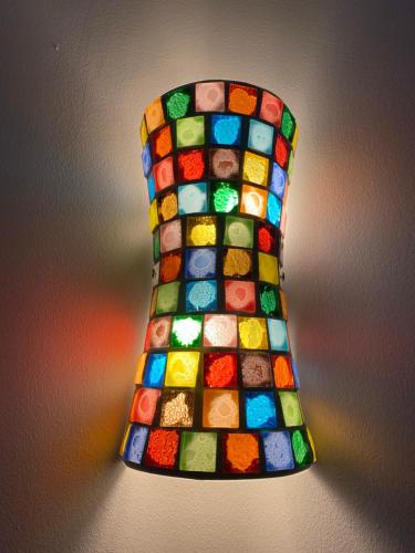 a lamp with a multicolored lampshade at Casa S’Arraval in Mahón