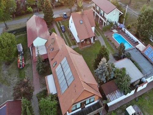 an aerial view of a house with a swimming pool at Pension am Hasenberg in Markische Heide