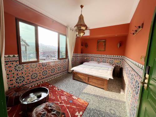 a bedroom with orange walls and a bed and a window at The Arabian Nights B&B in Chongqing