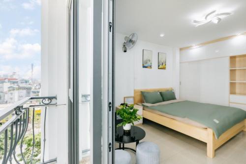 Ένα ή περισσότερα κρεβάτια σε δωμάτιο στο 9 LIGHT APARTMENT