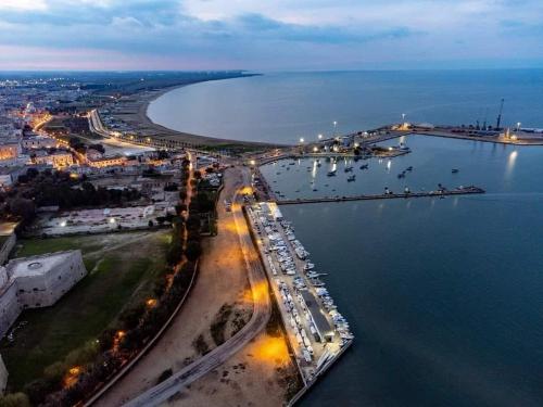 an aerial view of a harbor with boats in the water at CD Romanello (Mura S. Cataldo) in Barletta