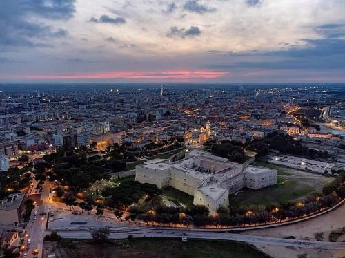 an aerial view of a city at night at CD Romanello (Mura S. Cataldo) in Barletta