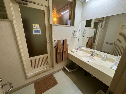 Bilik mandi di ホテルカスカベ Hotel Kasukabe