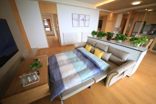 an overhead view of a living room with a couch at Colorful Yunnan Absolutely Beautiful Dian B&B in Kunming