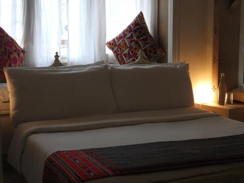 Ένα ή περισσότερα κρεβάτια σε δωμάτιο στο The Stepwell Hotel