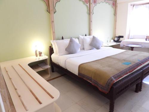 Ένα ή περισσότερα κρεβάτια σε δωμάτιο στο The Stepwell Hotel