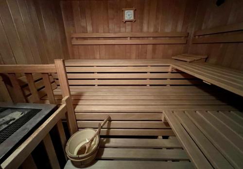 a sauna with two beds and a chair in it at Haus Schrofenstein in Lech am Arlberg