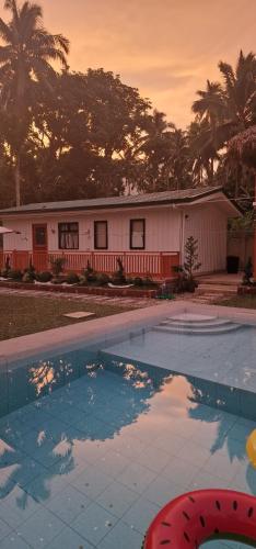 an empty swimming pool in front of a house at Birbeck Lodge in Bulusan