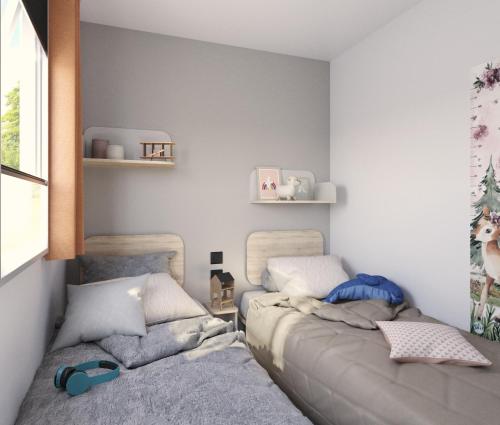 Katil atau katil-katil dalam bilik di Camping Lido Verbano