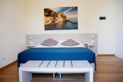 Postel nebo postele na pokoji v ubytování B&B Via delle 5 Terre