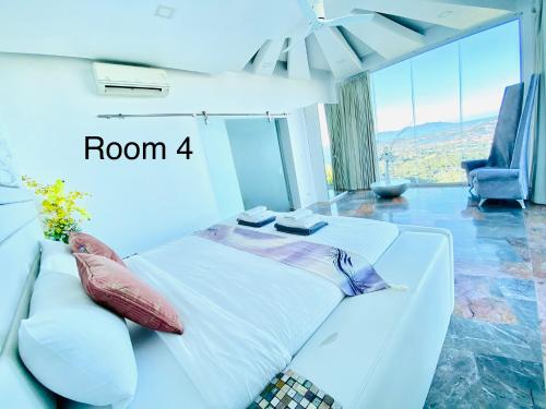 a bedroom with a white bed with a room sign at Best world vision in Chaweng