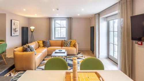 a living room with a couch and a table at The Small House at The Heaning Estate in Windermere