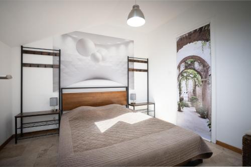 a bedroom with a large bed in a room at grange rénovée en gîte/maison/chalet in Arreau