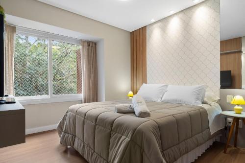 Ένα ή περισσότερα κρεβάτια σε δωμάτιο στο Apartamento Hispânia 1 dorm by Achei