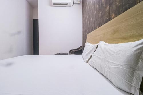 Кровать или кровати в номере OYO Prime Property