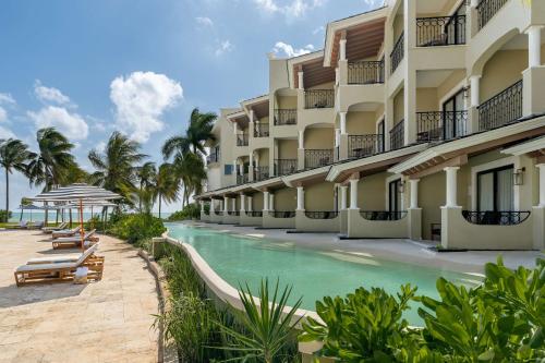 a resort with a swimming pool and a resort at Hyatt Zilara Riviera Maya Adults Only All-Inclusive in Playa del Carmen