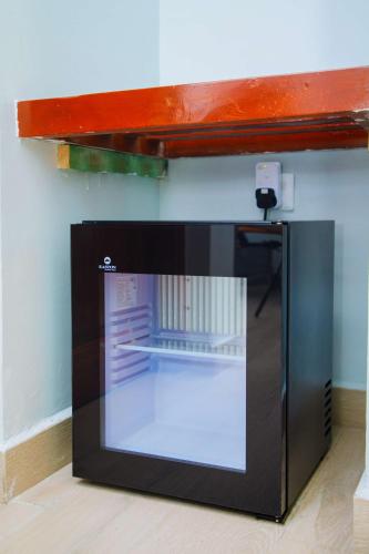 a microwave oven with its door open in a room at Best Western Dodoma City Hotel in Dodoma