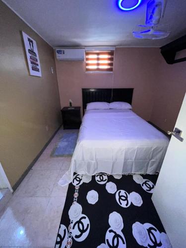 Katil atau katil-katil dalam bilik di Chic Nity Hôtel