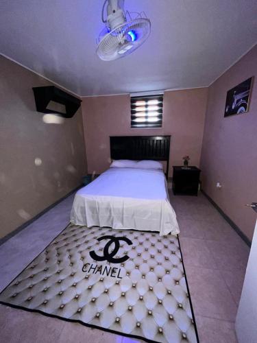 Katil atau katil-katil dalam bilik di Chic Nity Hôtel