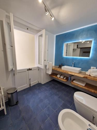 a bathroom with a white sink and a mirror at Casa Vacanze Penelope in Pizzo