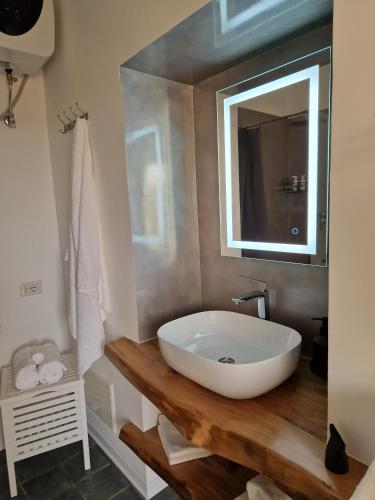a bathroom with a white sink and a mirror at Casa Vacanze Penelope in Pizzo