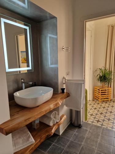 a bathroom with a tub and a sink and a mirror at Casa Vacanze Penelope in Pizzo