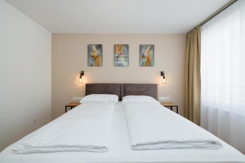 Posteľ alebo postele v izbe v ubytovaní Vienna Stay Apartments Tabor 1020