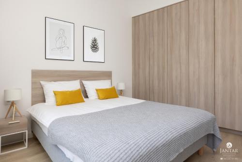 Ένα ή περισσότερα κρεβάτια σε δωμάτιο στο Shellter Apartments 117 Ł - by Jantar Apartamenty