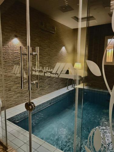 a large swimming pool in a building with a swimming pool at شقق منازل الدانة للشقق المخدومة in Abha