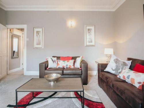 a living room with two couches and a coffee table at Halifax Town House - Cosy - Sleeps 5 in Halifax